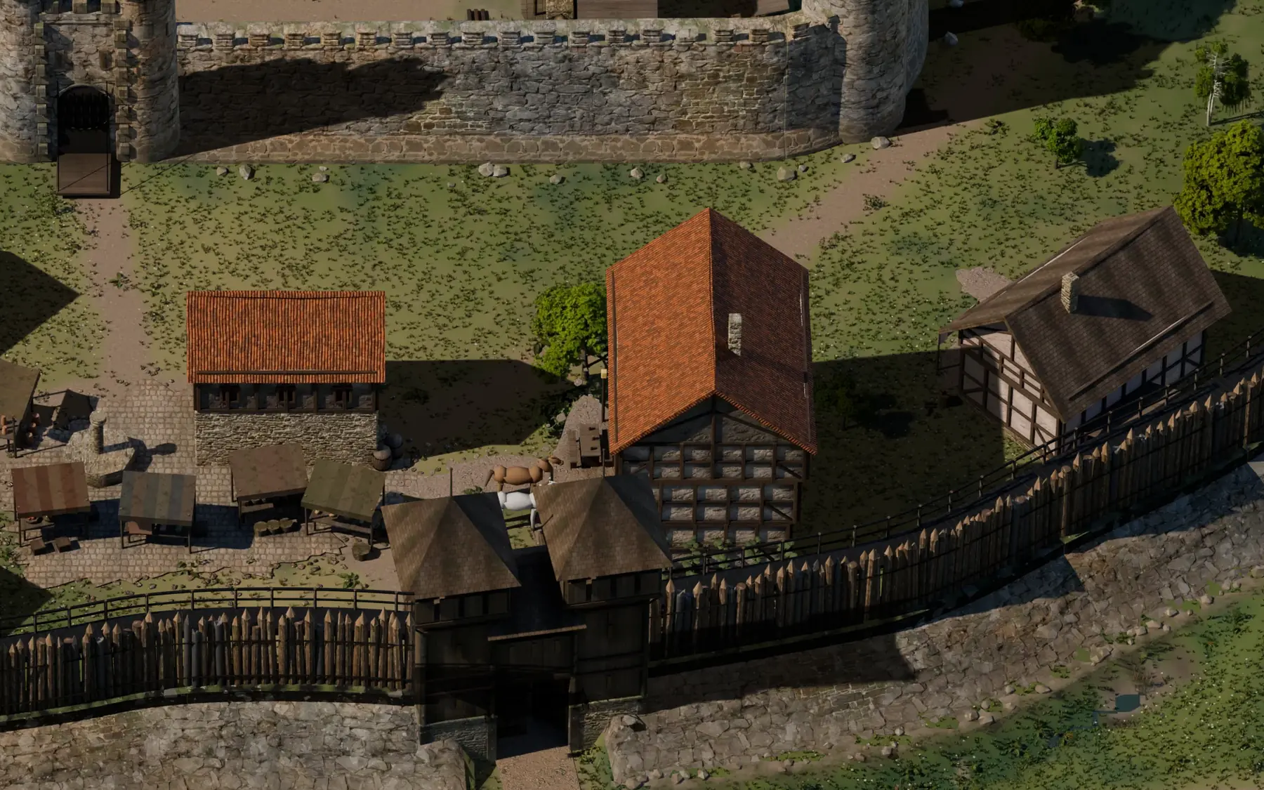 Torhaus in der Palisade mit Steinsockel, dahinter Fachwerkhäuser und die Kernmauer.